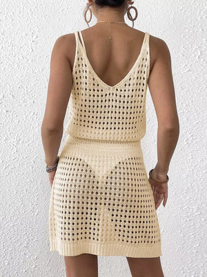 Beige openwork V-neck knit cover-up dress with spaghetti straps and a mini skirt.