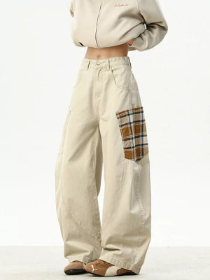 Men's beige cotton wide-leg sweatpants with plaid patchwork detail.
