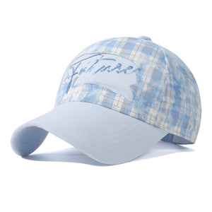 Blue plaid baseball cap with embroidered text and light blue brim.