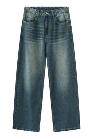 Faded wash wide-leg denim jeans in medium blue with distressed details.
