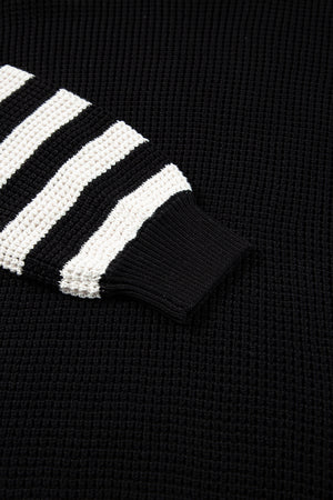 Black knit turtleneck sweater with white stripe sleeves