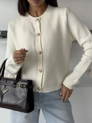 White textured knit cardigan with gold button detail and crew neck.