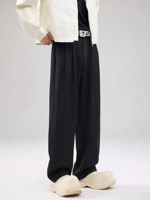 Men's black wide-leg sweatpants with drawstring and pleated front detail.