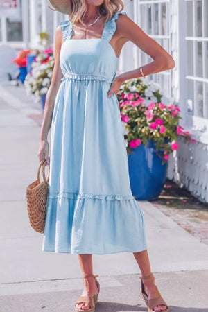 Light blue ruffle-trimmed maternity dress with square neckline and tiered skirt.