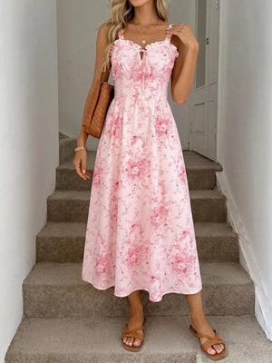 Pink floral cami midi dress with frill neckline and tie detail.