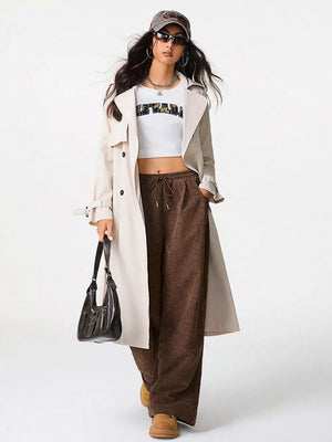 Brown corduroy wide-leg maternity pants with drawstring waist and cargo pockets.