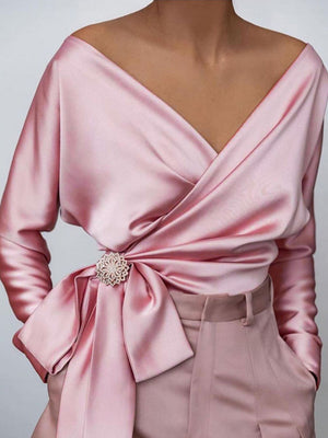 Blush pink satin blouse with brooch detail and draped neckline