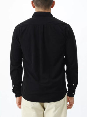 Black long sleeve buttoned shirt with back pleats and buttoned cuffs.