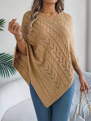 Camel cable knit poncho with chevron detail and V-neck, styled with jeans.