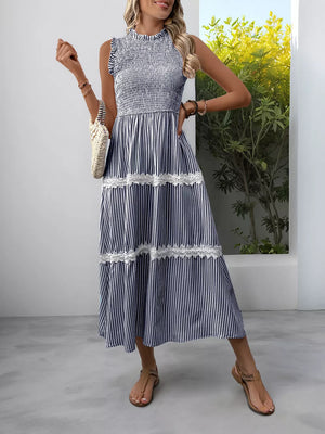 Navy blue striped midi dress with smocked bodice and lace trim.