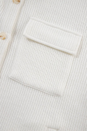White textured corduroy overshirt with patch pocket and button detail.
