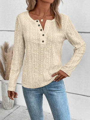 Cream textured henley long sleeve blouse with button detail and open knit pattern.