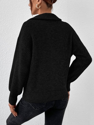 Black ribbed collar zip-up knit sweater with balloon sleeves.