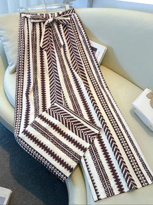 Geometric print wide-leg maternity pants with bow tie waist in white and brown.