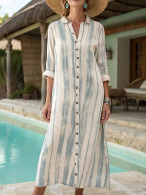 Beige button-down midi dress with blue vertical abstract stripes and pockets.