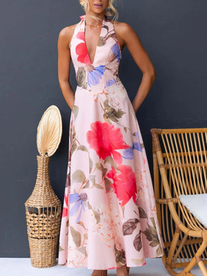 Pink floral halter neck maxi dress with a deep V-neck and a-line skirt.