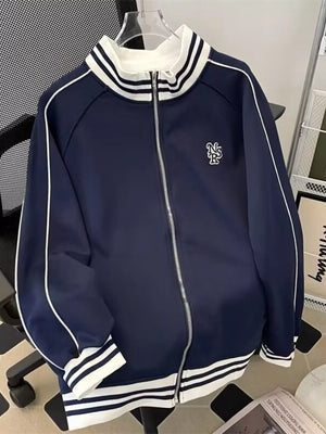 Navy blue zip-up sweatshirt with white piping and striped collar and cuffs.