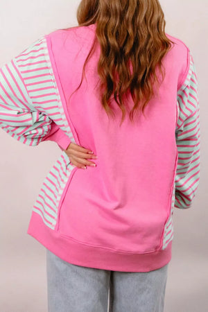 79% cotton, 21% polyester Care instructions: Machine wash cold sweatshirt in Fuchsia Pink with relaxed silhouette