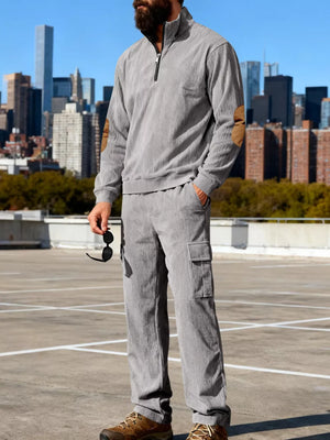 Gray corduroy two-piece set with quarter zip sweatshirt and cargo pants.