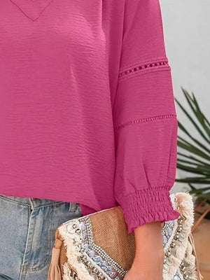 Elegant long sleeve blouse in Rose Purple polyester with smocked cuffs and eyelet detail.