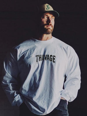 White long sleeve t-shirt with black dripped logo detail on chest