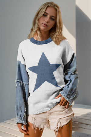 White knit sweater with denim sleeves, featuring a large blue starburst.