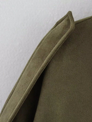 Oversized zip-up jacket in military green with textured fabric and detailed collar.