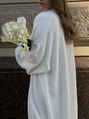 White plush maxi cardigan with balloon sleeves and a soft texture.