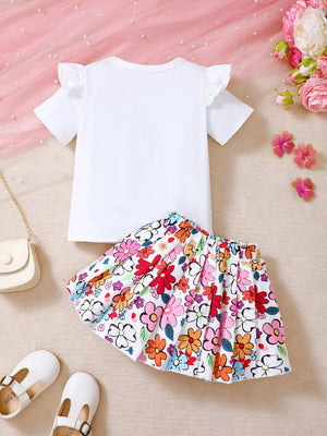 White baby set with ruffle sleeves and a colorful floral print skirt.