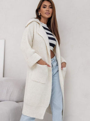 Cream oversized knit lapel cardigan with pockets and cuffed sleeves.