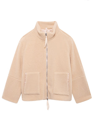 Tan sherpa jacket with stand collar, zip front, and two patch pockets with satin trim.