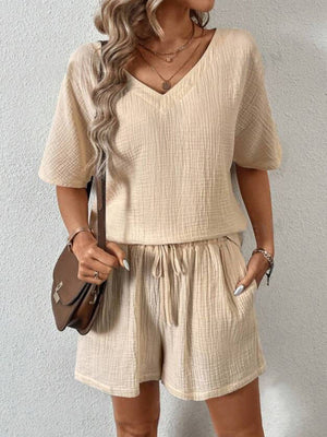 Tan textured gauze lounge set with V-neck top and drawstring shorts.