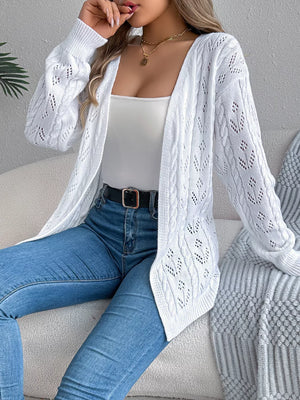 White openwork cable knit long sleeve cardigan with intricate details