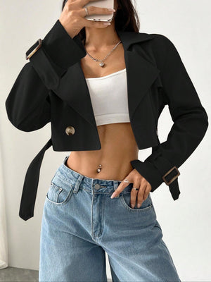 Black cropped double-breasted trench coat with belt and adjustable cuffs.