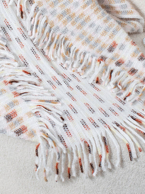 Textured fringe shawl cardigan in white with multicolor woven pattern and fringe details.