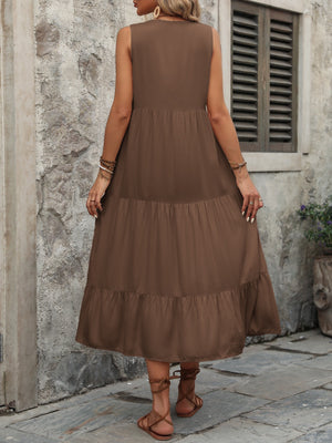 Brown tiered midi sundress with button detail and sleeveless design.