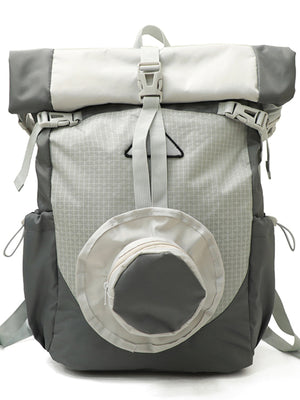 Sleek roll-top nylon backpack in light gray and dark gray with textured front panel and circular zip pocket.