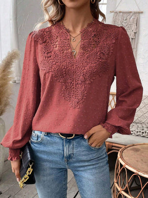 Burnt Coral embroidered yoke blouse with puff sleeves and textured fabric.