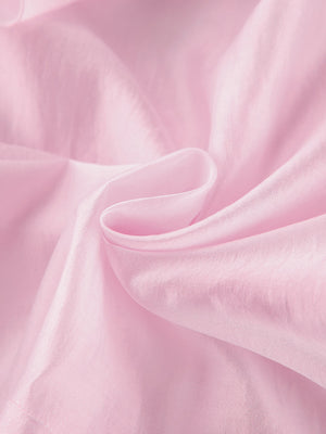 Blush pink long sleeve blouse with ruffle trim detail, casual women's apparel.