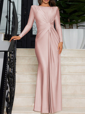 Pink ruched knot front maxi dress with long sleeves and a boat neckline.