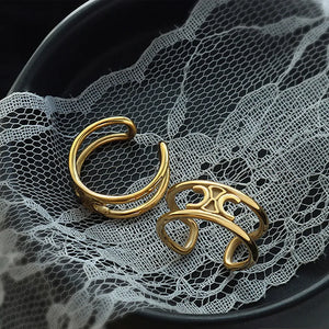Gold double banded open ring with cutout detail.