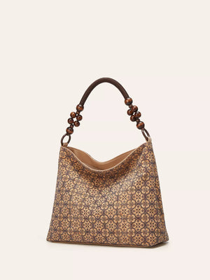 Vibrant Bohemian Hobo Tote in wheat color with geometric pattern and beaded strap.