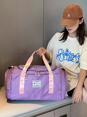 Taro Purple Oxford cloth duffle bag with pink straps and zippered compartments.