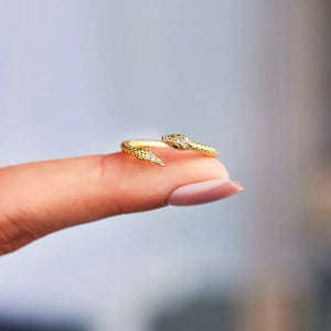 Gold bypass ring with diamond accent snake design