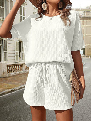 White waffle knit drawstring co-ord set with short sleeves and shorts.