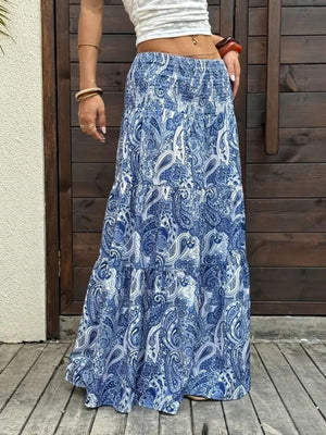 Bohemian paisley maxi skirt in blue with tiered ruffle hem and smocked waist.