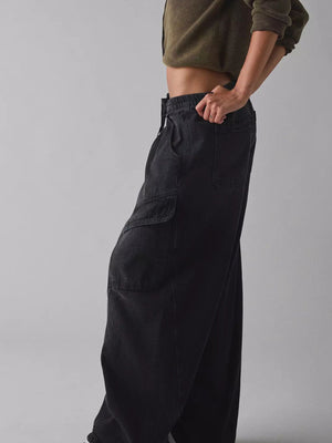 Black denim cargo jeans with drawstring waist and large side pockets.