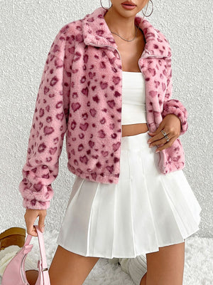 Pink faux fur track jacket with heart print, zip front, and collar.