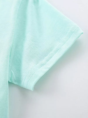 Toddler tee in light blue cotton with short sleeves and a clean hem.
