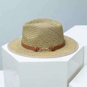Woven straw fedora hat with tan leather band and gold buckle detail.